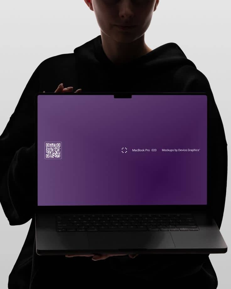 A person holding an open laptop showing the Myshoplet storefront and dashboard