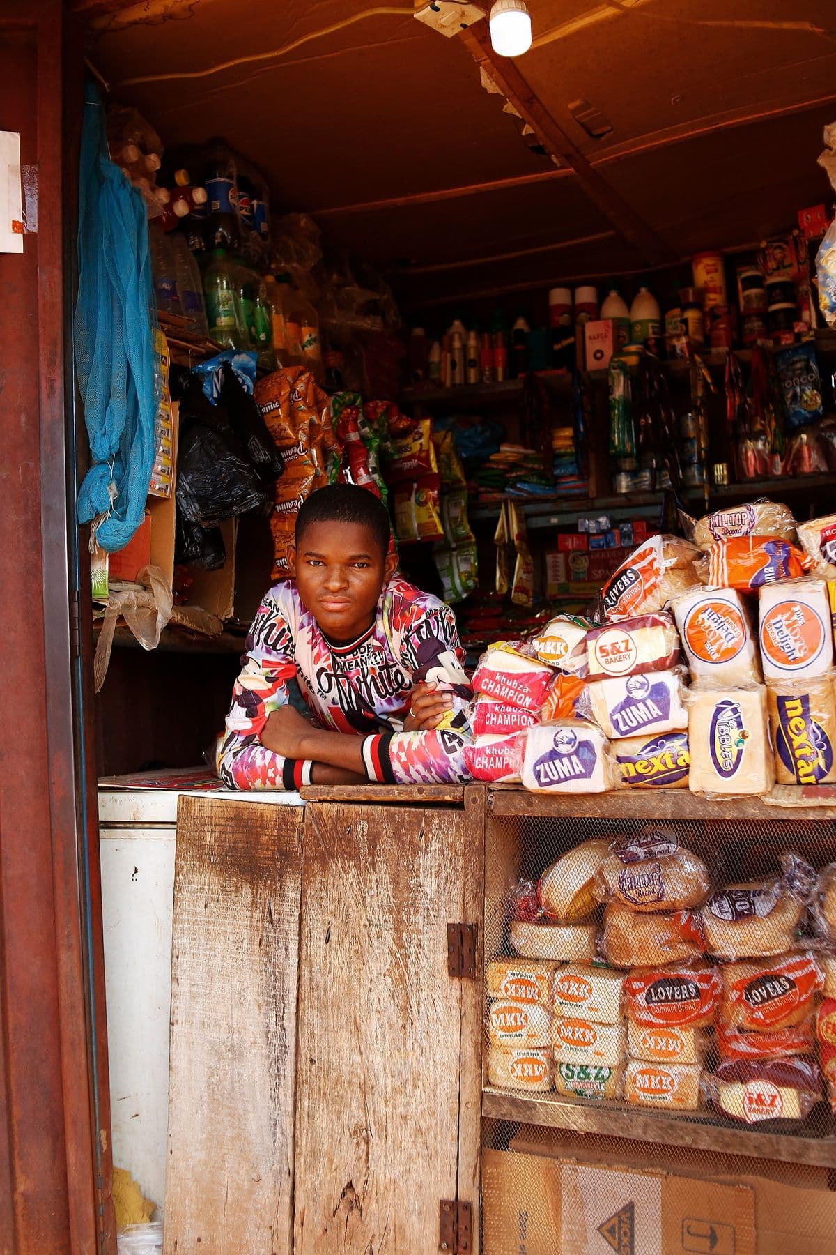 Stocked shelves in a small Nigerian shop